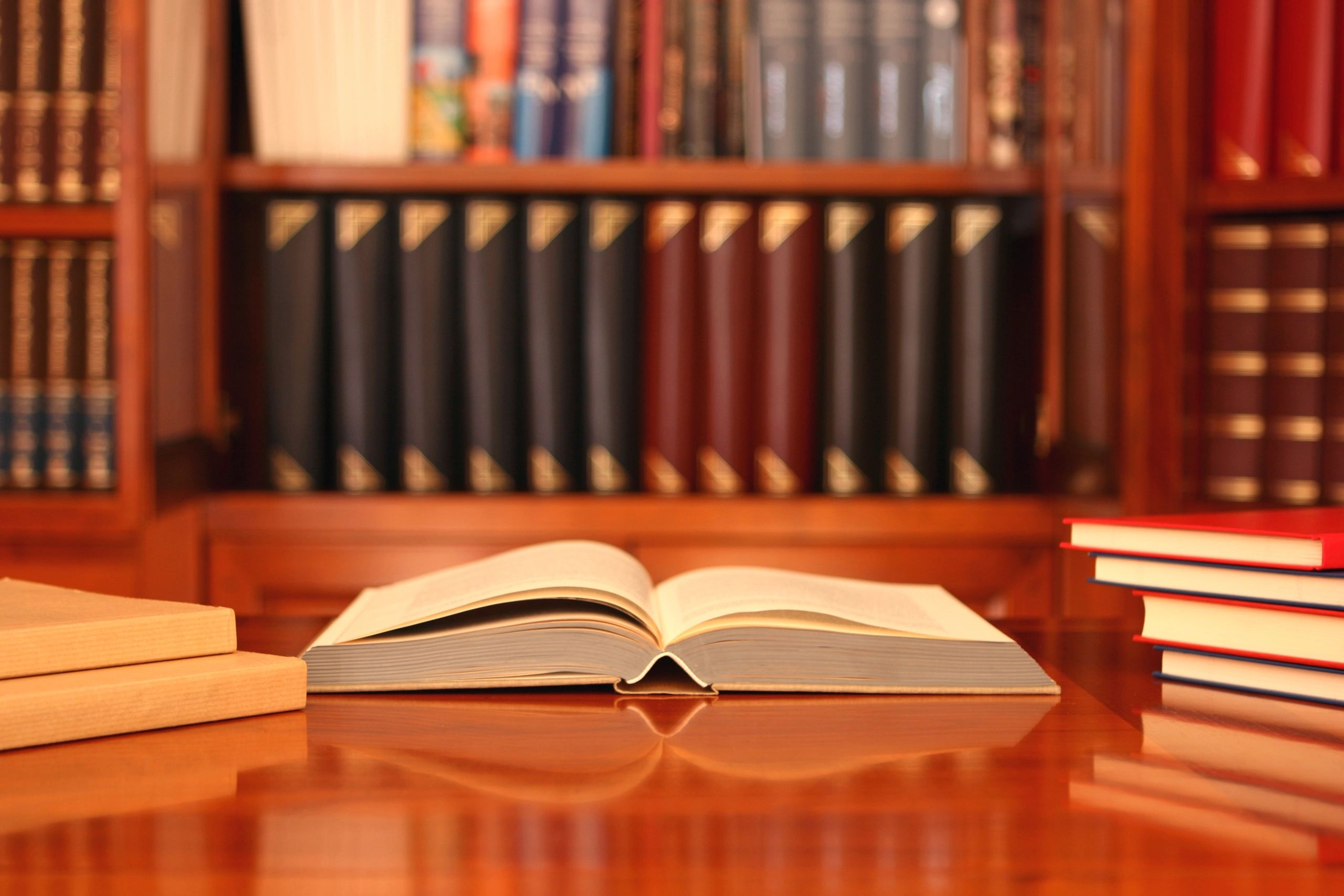 Open book on a desk representing reading and research