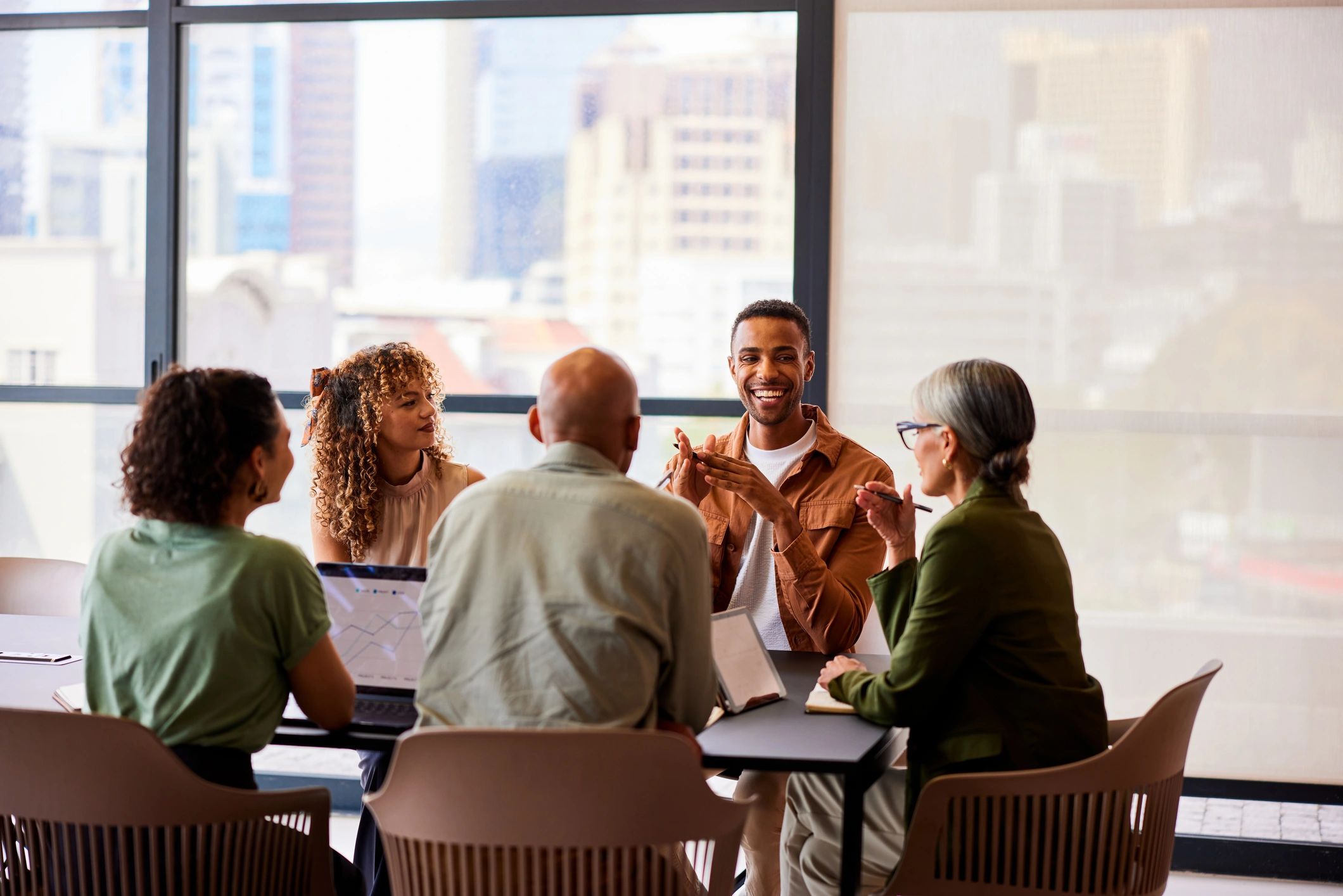 People in a meeting around a table